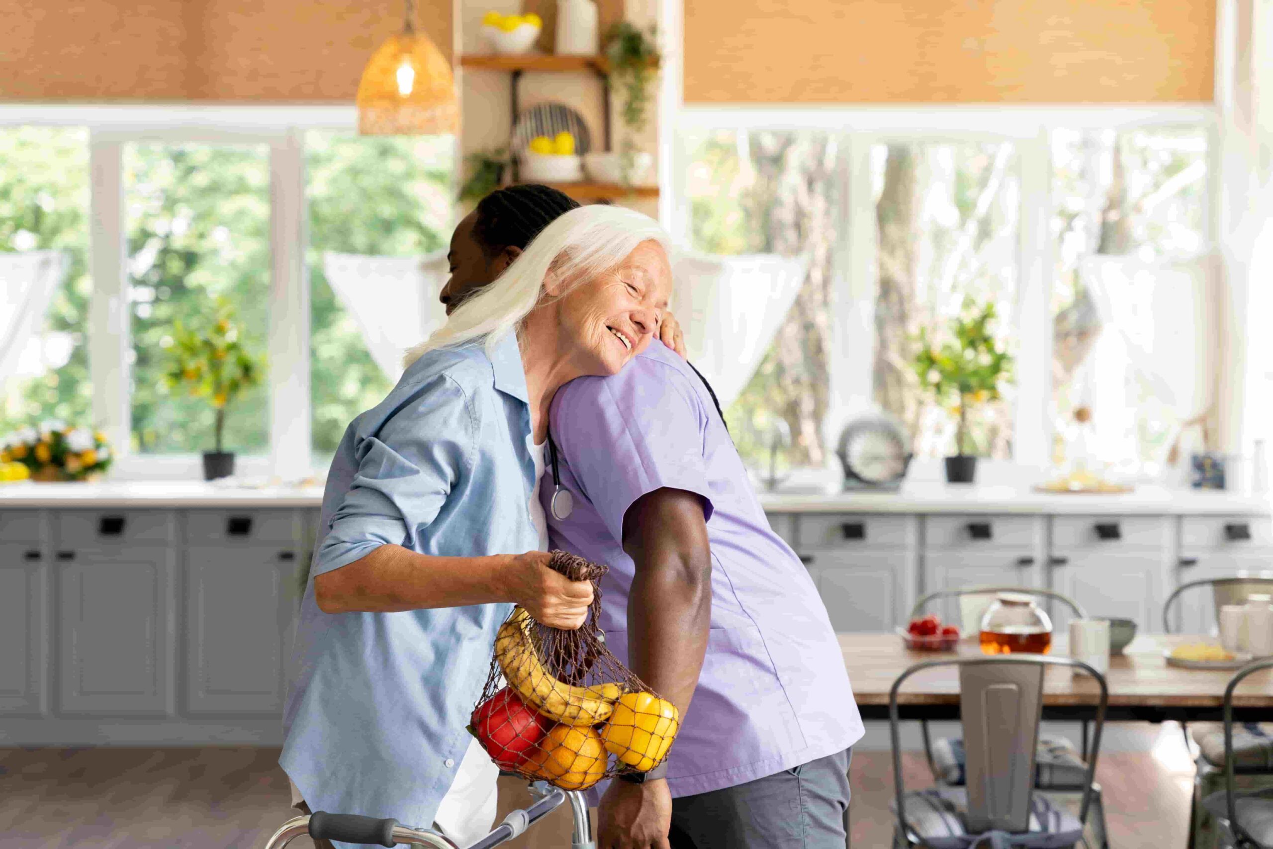 Older adult smiling and hugging caregiver, symbolizing Dr. Cook’s compassionate home medical care in 85254 Scottsdale.
