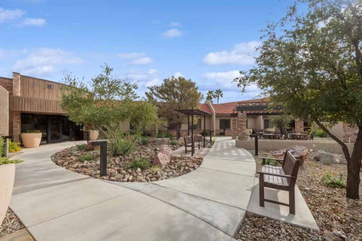 Peaceful walking path in the landscaped courtyard of Pueblo Norte Senior Living in Scottsdale, AZ.