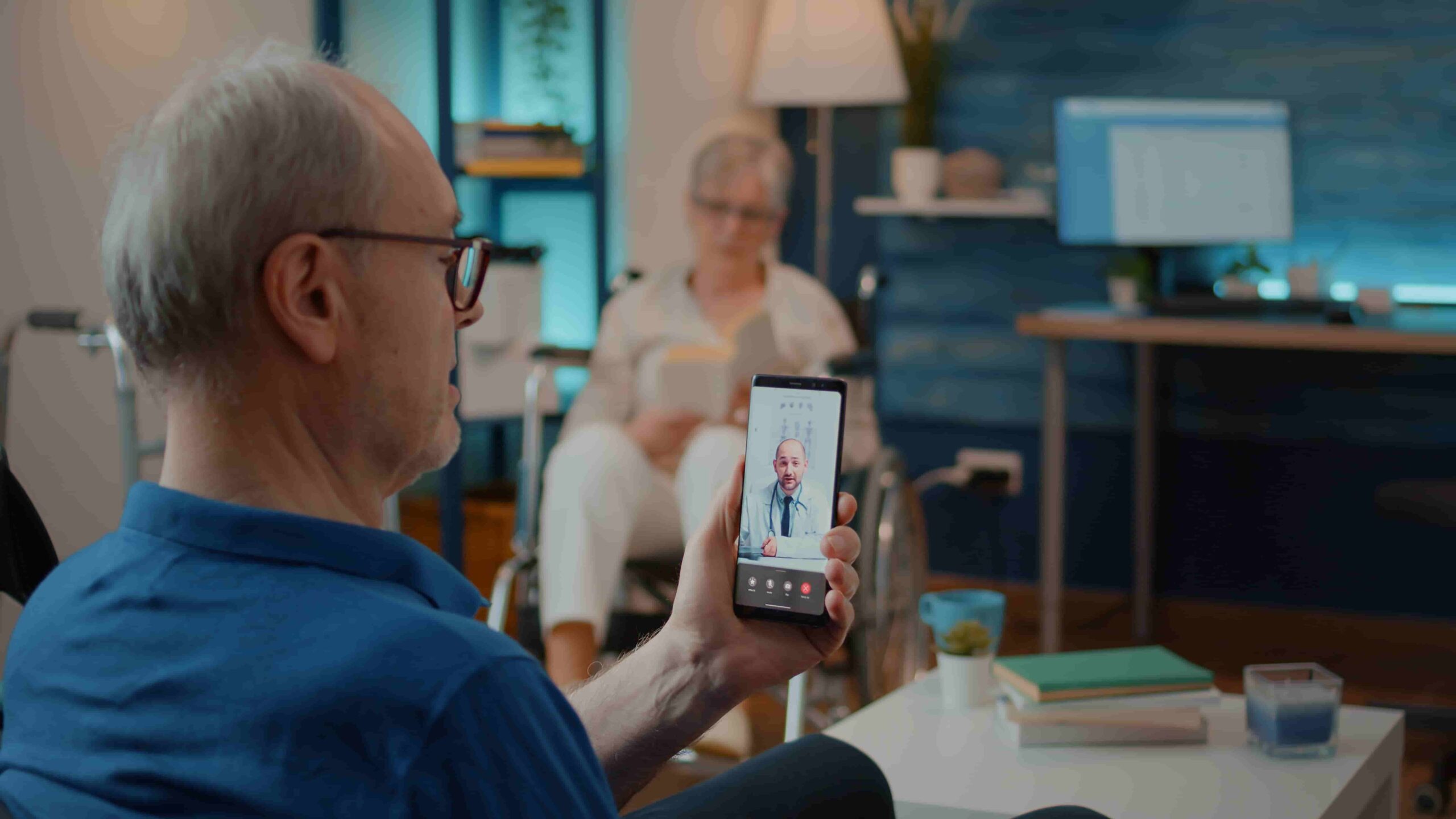 Older adult using telemedicine to consult a doctor from home, reflecting Scottsdale home health care services by Dr. Cook and Target1 Medical.