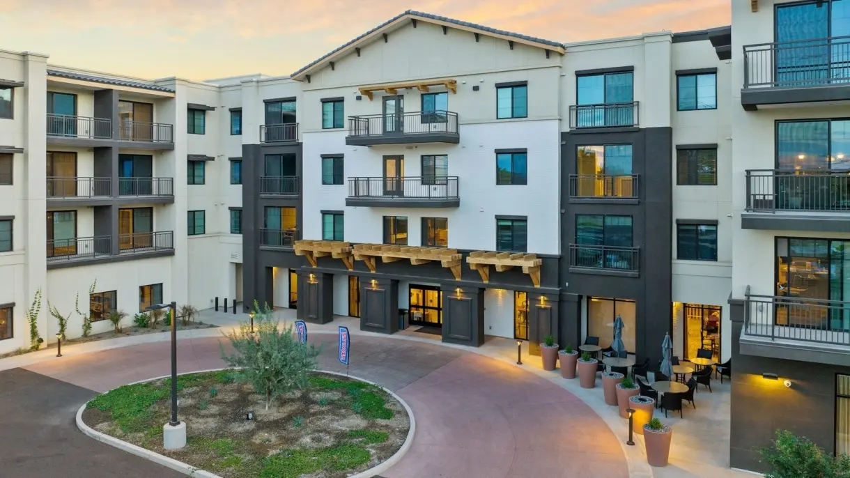 Front view of Acoya Shea senior living community in Scottsdale with modern architecture and outdoor seating area
