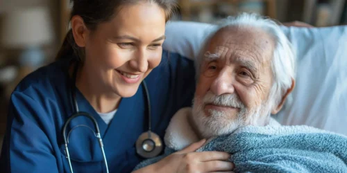 Smiling nurse providing at-home medical care to an elderly man in 85262