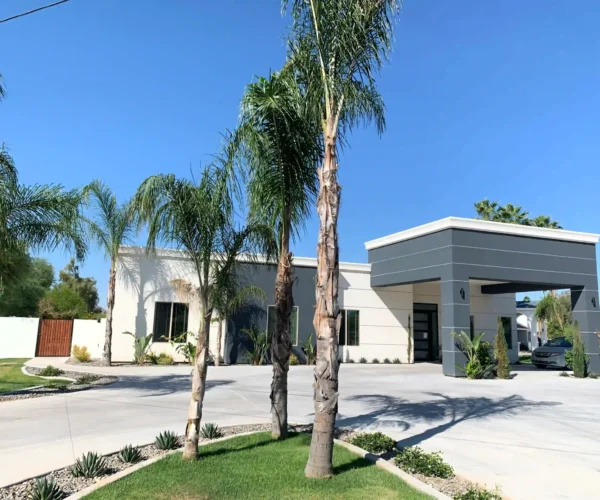 Agave Manor residential care home in Scottsdale, Arizona with palm trees and modern exterior view