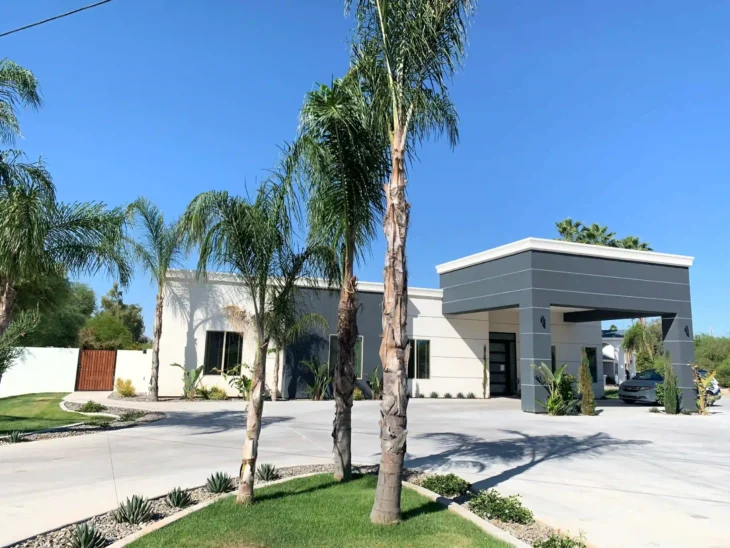 Agave Manor residential care home in Scottsdale, Arizona with palm trees and modern exterior view