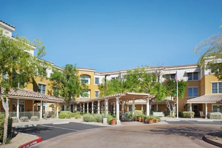 Assisted living facility exterior with landscaped entrance in Scottsdale