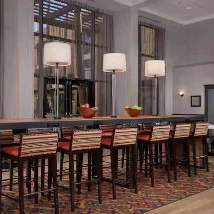 Modern community table and seating area inside Hampton Inn Scottsdale on Shea Boulevard