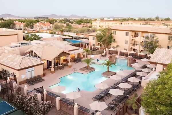 Aerial view of the pool and resort buildings at Hilton Vacation Club Scottsdale Villa Mirage in Scottsdale, AZ