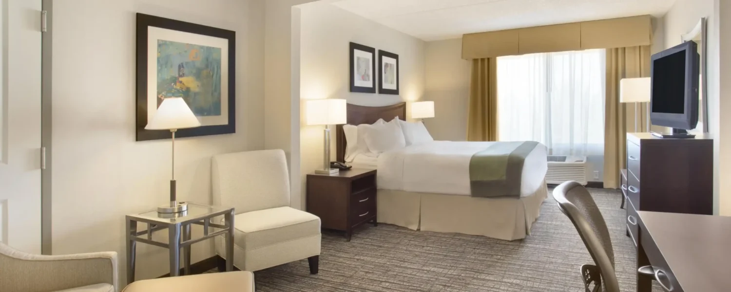 Spacious king suite with seating area, work desk and natural light at Holiday Inn & Suites Scottsdale North – Airpark