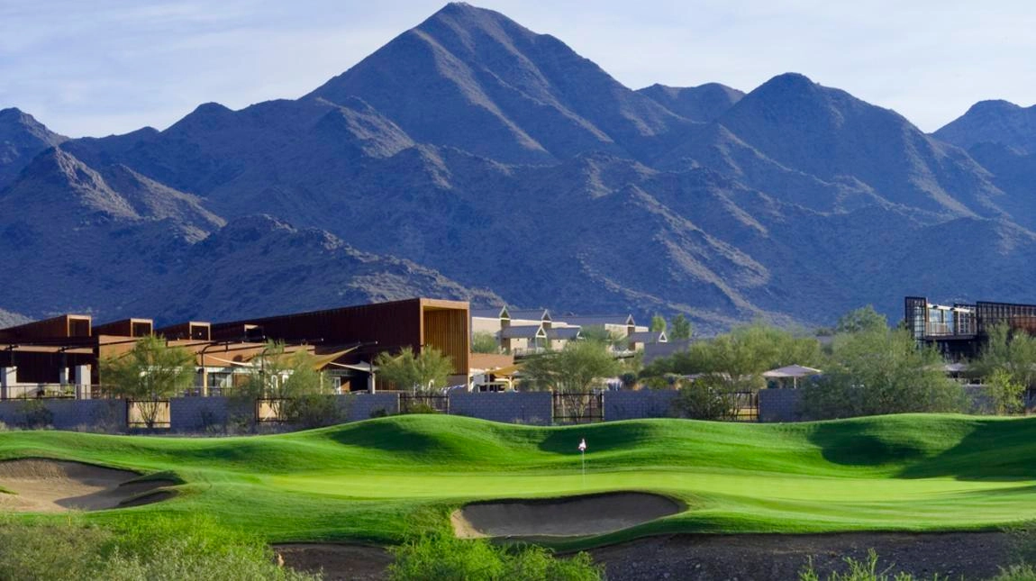 Scenic view of McDowell Mountain Golf Club with lush green fairway and mountain backdrop in Scottsdale, Arizona.