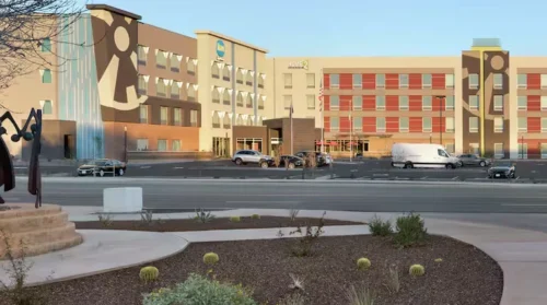 The modern exterior view of the Home2 Suites by Hilton Scottsdale Salt River hotel building and main entrance from the street.